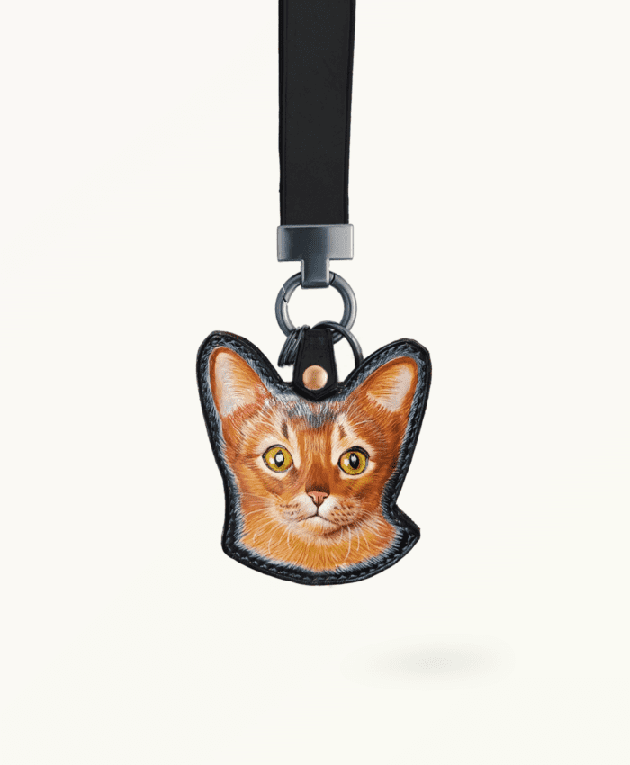 Custom shaped leather pet pendant with carved portrait